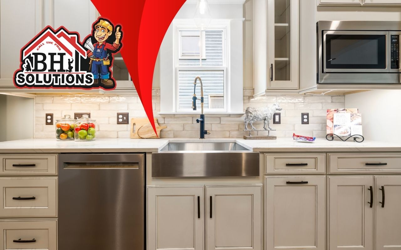 Kitchen with repainted cabinets in a modern gray tone.