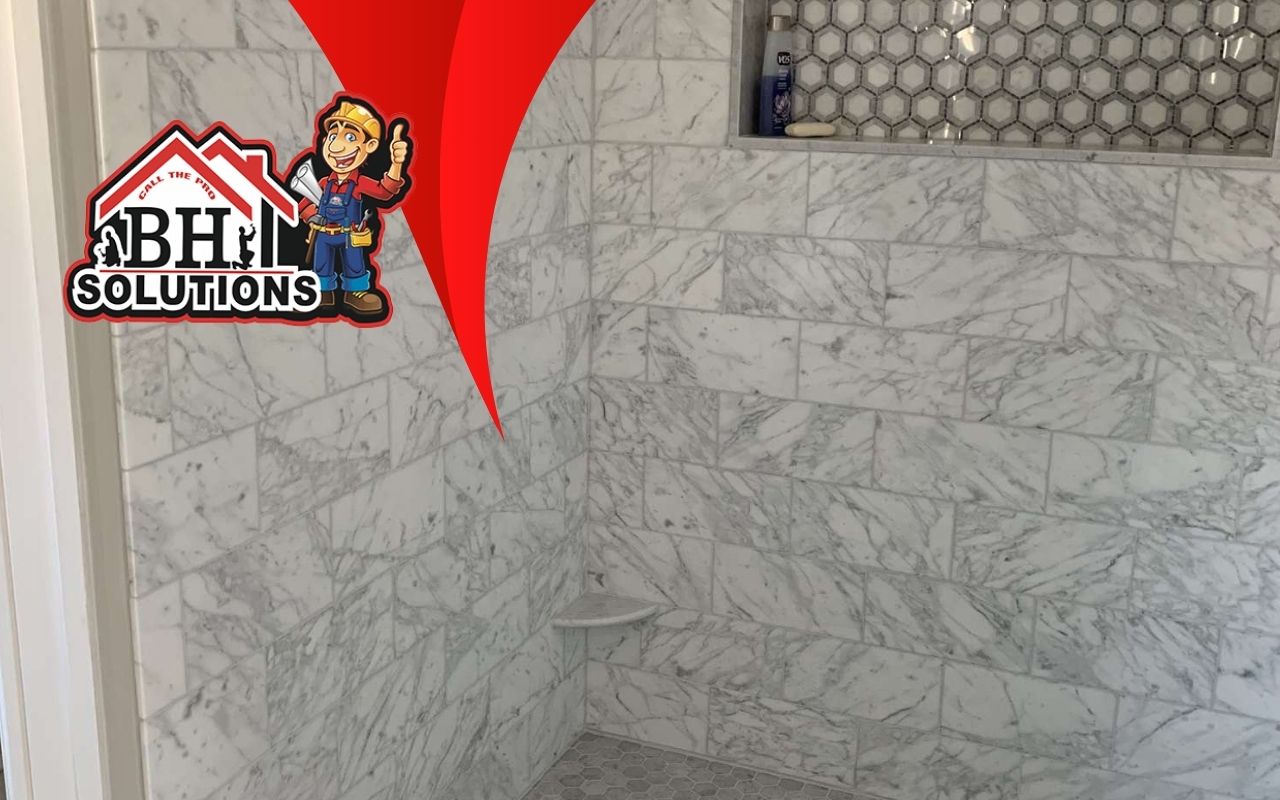 A homeowner installing new tiles in a shower.