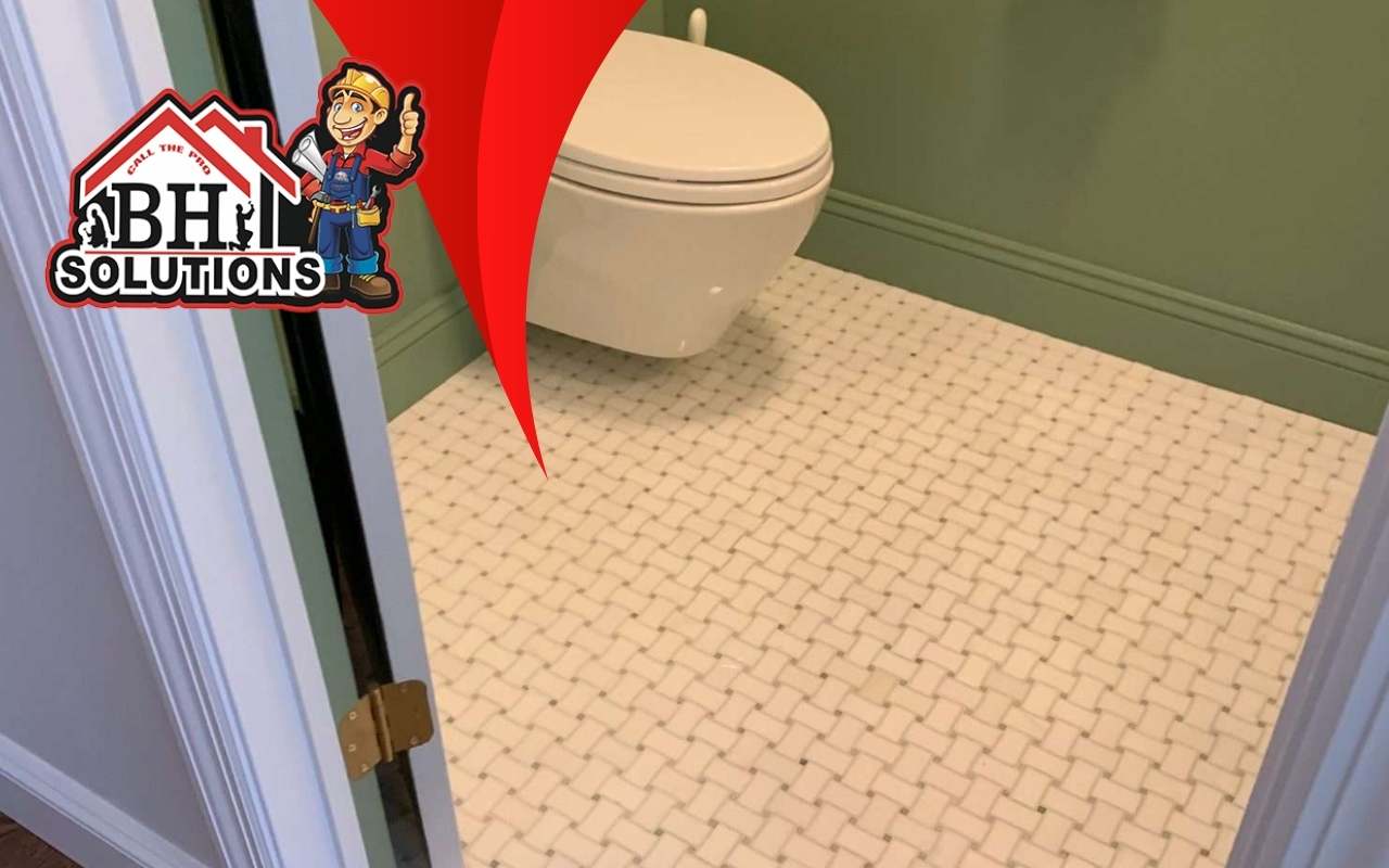 Geometric patterned tile floor in small bathroom space