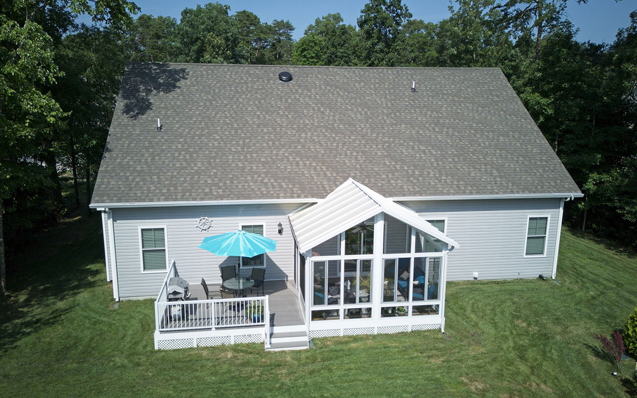 Expert Roofing Services technician performing roof repair safely