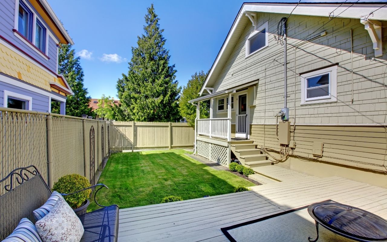 Exterior house painting crew working on a two-story home in Westchester County