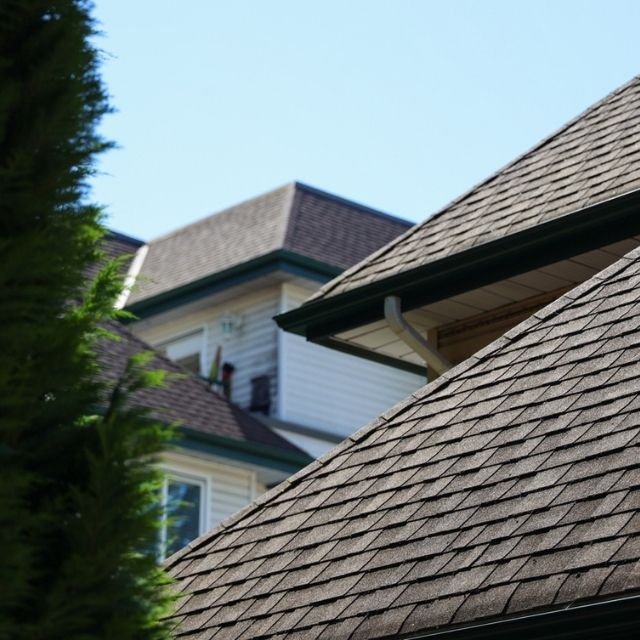 Local roofing specialist in Greenwich, CT talking with a homeowner