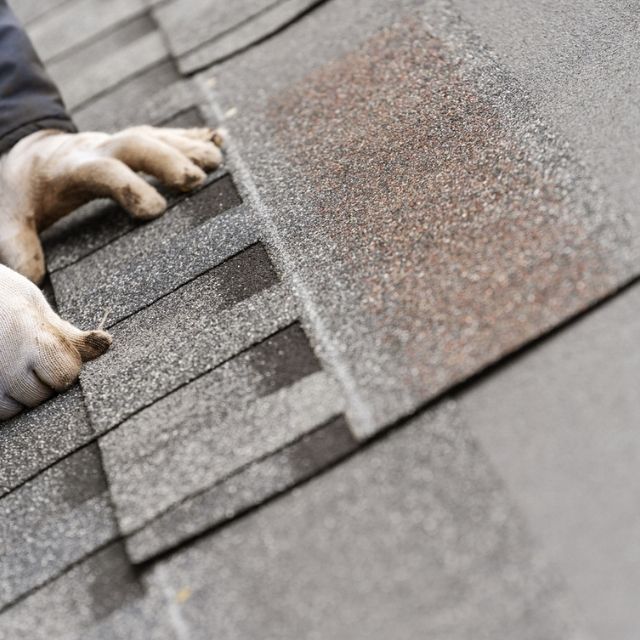 Roofing Contractor in Greenwich, CT doing a roof inspection